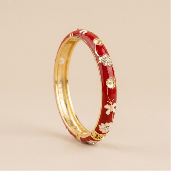 Red enamel floral butterfly gold bangle - front angled view